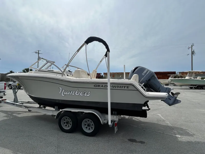 Slide: The Image of 2022 Grady-White Freedom 215 boat on trailer, parked outdoors. - 3