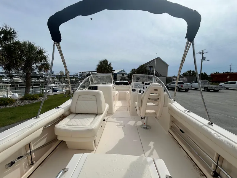 Slide: The Image of 2022 Grady-White Freedom 215 boat with seating, docked near marina. - 5