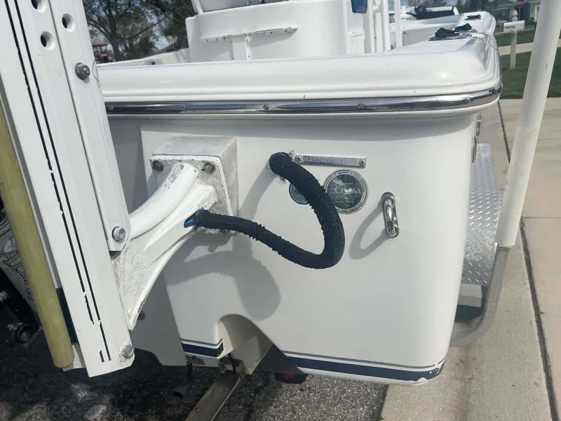 Slide: The Image of 2014 Sea Hunt SXS boat detail showing rear section with mounted equipment. - 13