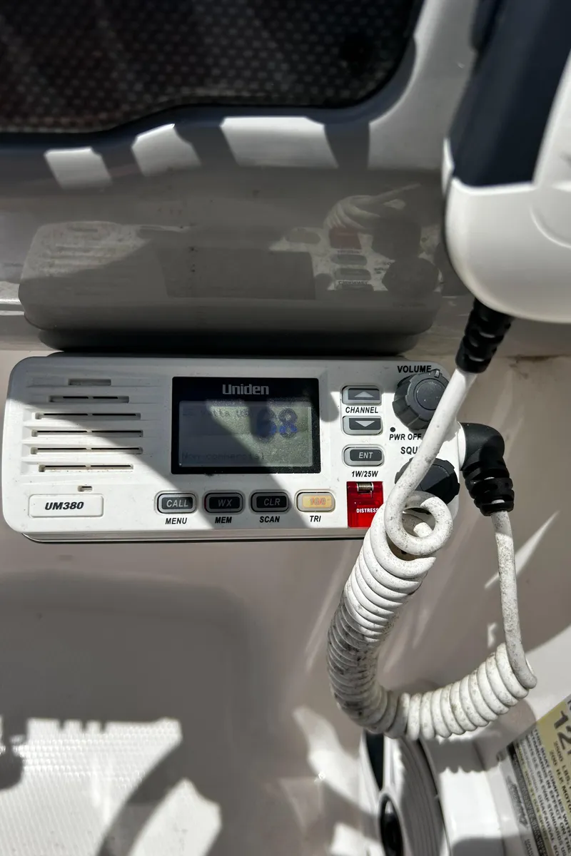Slide: The Image of Uniden marine radio on 2017 Chaparral 21 H2O Sport OB boat dashboard. - 16