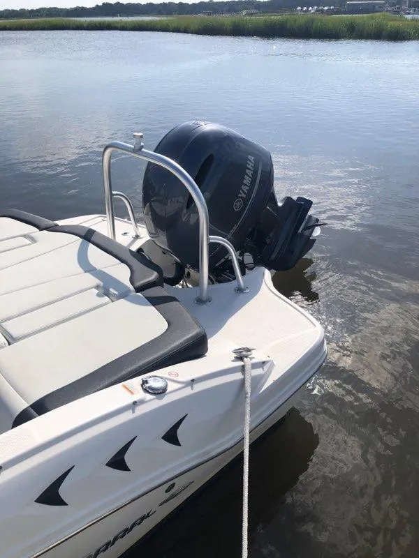 Slide: The Image of 2017 Chaparral 21 H2O Sport OB boat with Yamaha outboard motor on calm water. - 5