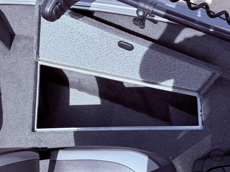 Slide: The Image of Open storage compartment in 2018 Lund 1675 Impact Sport boat interior. - 12