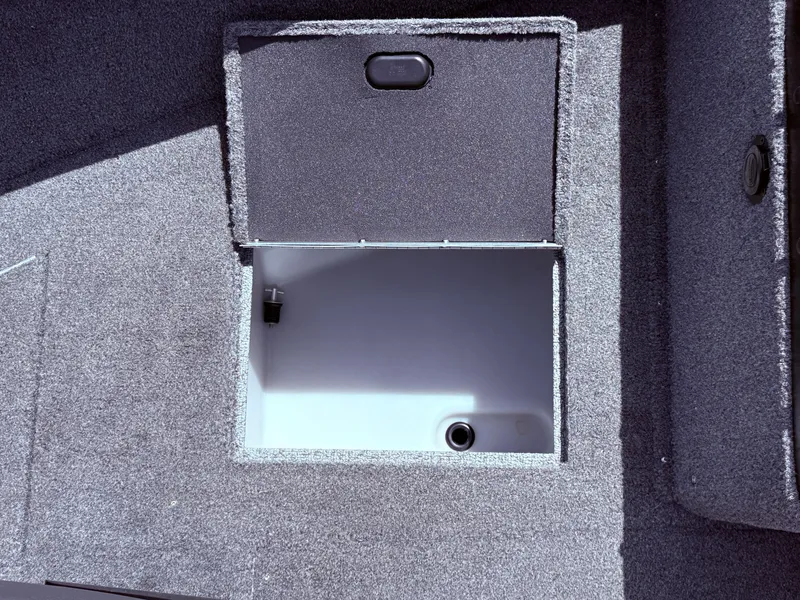 Slide: The Image of Open storage compartment in 2018 Lund 1675 Impact Sport boat. - 14