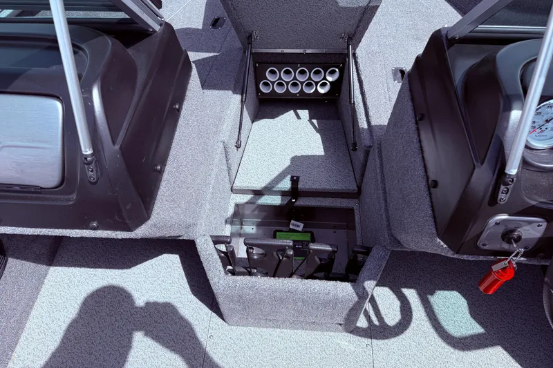 Slide: The Image of 2018 Lund 1675 Impact Sport boat interior with rod storage compartment. - 15