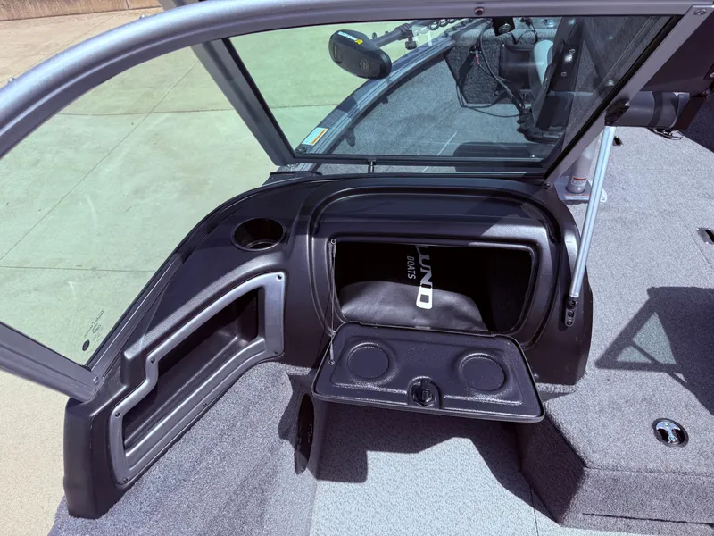 Slide: The Image of 2018 Lund 1675 Impact Sport boat interior with open storage compartment. - 22