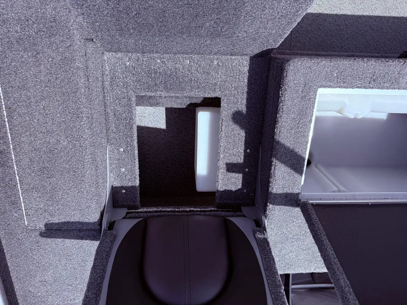 Slide: The Image of 2018 Lund 1675 Impact Sport boat interior with storage compartments and seating. - 23