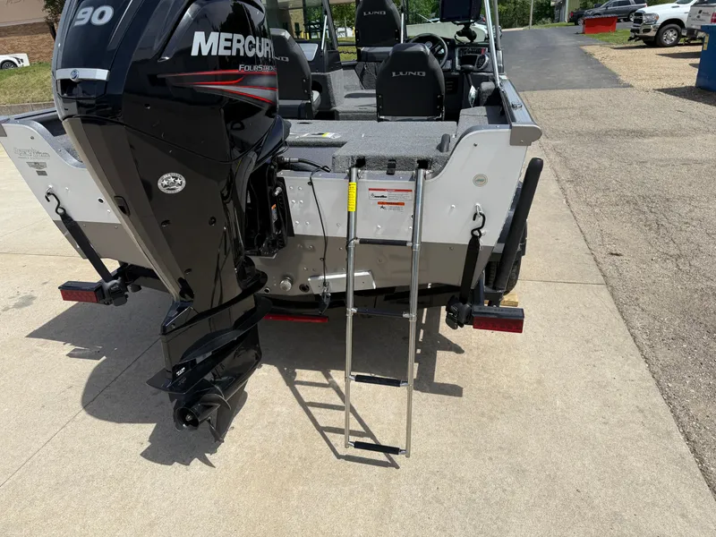 Slide: The Image of 2018 Lund 1675 Impact Sport boat with Mercury engine and ladder on a sunny day. - 5