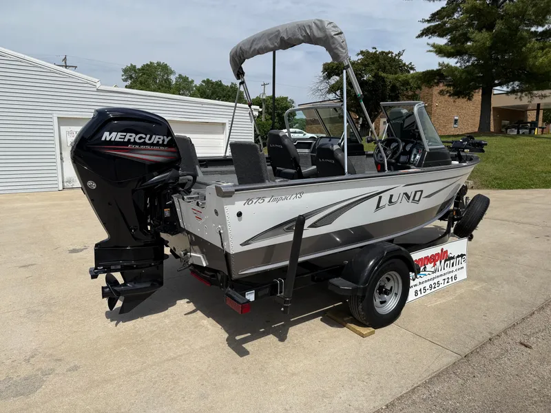 Slide: The Image of 2018 Lund 1675 Impact Sport boat with Mercury engine on trailer. - 6