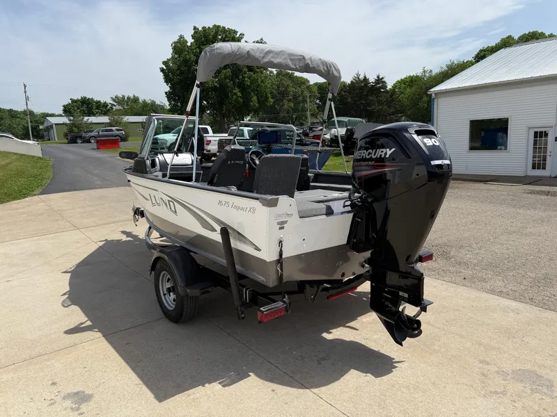 Slide: The Image of 2018 Lund 1675 Impact Sport boat with Mercury outboard motor on a trailer. - 9