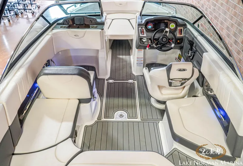 Slide: The Image of 2016 Chaparral 227 SSX SURF boat interior with modern seating and dashboard. - 13