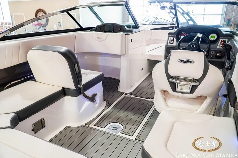 Slide: The Image of 2016 Chaparral 227 SSX SURF boat interior with sleek seating and modern dashboard. - 14