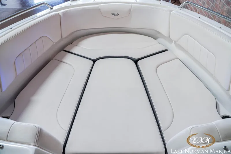 Slide: The Image of 2016 Chaparral 227 SSX SURF boat interior with white cushioned seating. - 15
