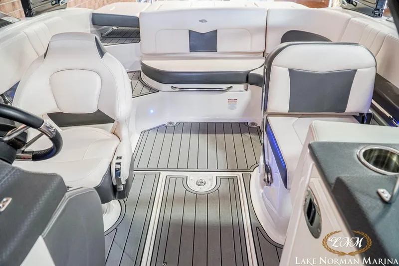 Slide: The Image of 2016 Chaparral 227 SSX SURF boat interior with white and gray seating, Lake Norman Marina. - 16