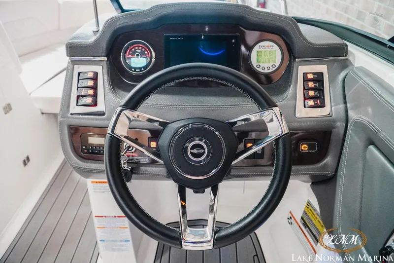 Slide: The Image of Steering wheel and dashboard of 2016 Chaparral 227 SSX SURF boat at Lake Norman Marina. - 18
