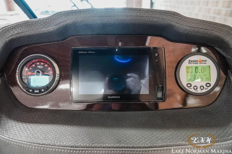 Slide: The Image of Dashboard of 2016 Chaparral 227 SSX SURF with Garmin GPS and speed controls. - 19