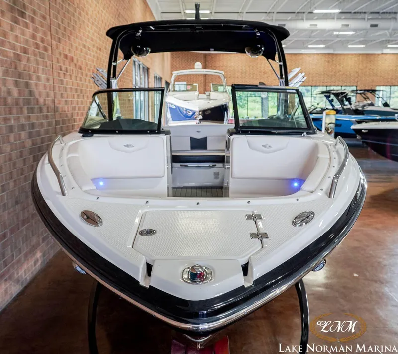 Slide: The Image of 2016 Chaparral 227 SSX SURF boat displayed indoors at Lake Norman Marina. - 3