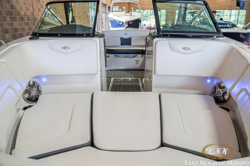 Slide: The Image of 2016 Chaparral 227 SSX SURF boat interior with white seating and modern design. - 4