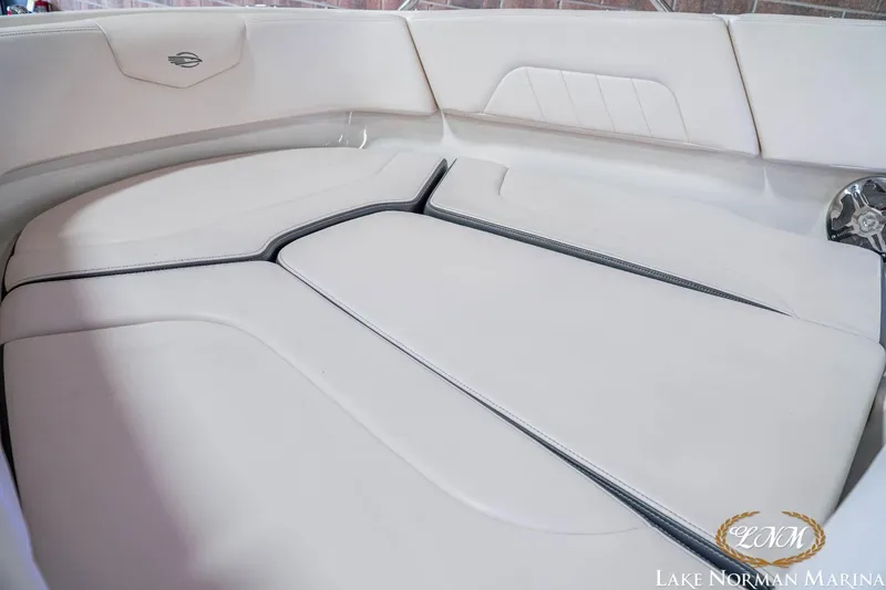 Slide: The Image of 2016 Chaparral 227 SSX SURF boat interior with white cushioned seating. - 5