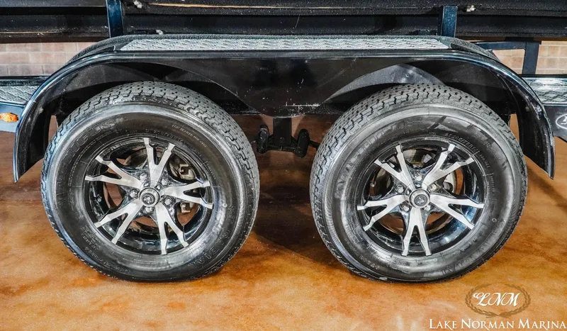 Slide: The Image of Trailer wheels of a 2016 Chaparral 227 SSX SURF at Lake Norman Marina. - 9