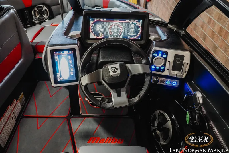 Slide: The Image of 2021 Malibu 23 LSV boat dashboard with modern controls and digital displays. - 16