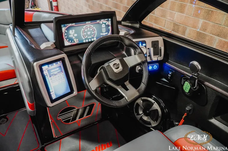 Slide: The Image of 2021 Malibu 23 LSV boat dashboard with modern controls and digital displays. - 17