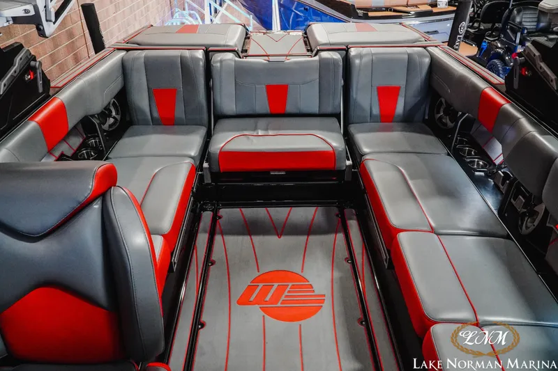Slide: The Image of Interior of 2021 Malibu 23 LSV boat with red and gray seating at Lake Norman Marina. - 20