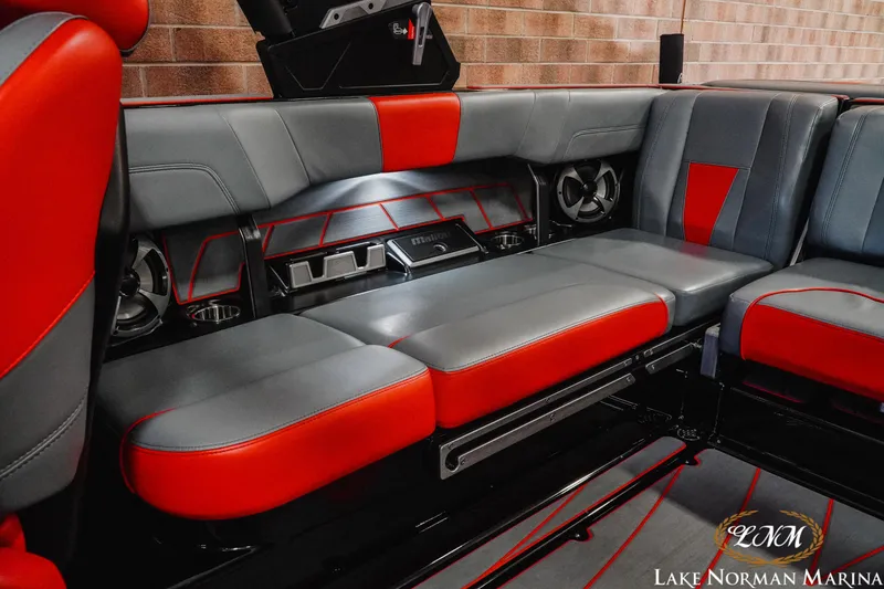 Slide: The Image of 2021 Malibu 23 LSV boat interior with red and gray seating at Lake Norman Marina. - 21