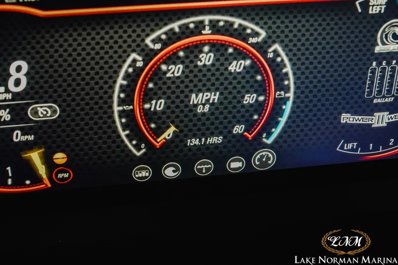 Slide: The Image of Dashboard of 2021 Malibu 23 LSV boat showing speedometer and controls. - 25