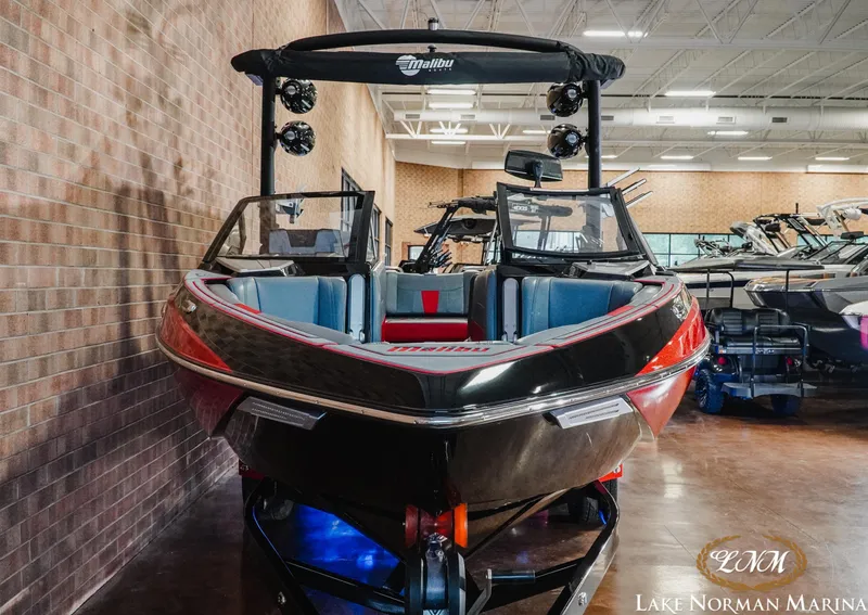 Slide: The Image of 2021 Malibu 23 LSV boat displayed at Lake Norman Marina showroom. - 4