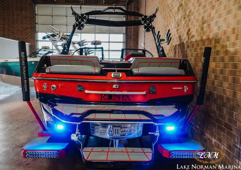 Slide: The Image of 2021 Malibu 23 LSV boat with vibrant red finish at Lake Norman Marina. - 7