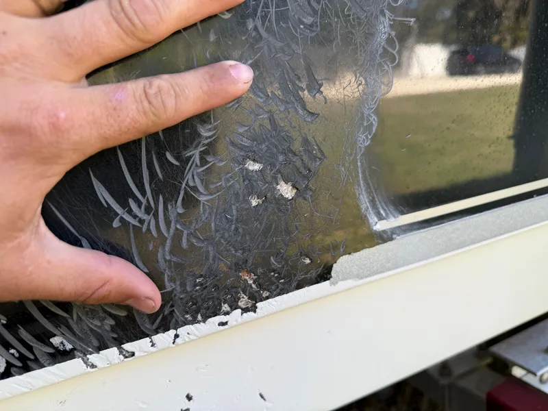 Slide: The Image of Close-up of a damaged window on a 2014 Sea Hunt Ultra 211 boat. - 10