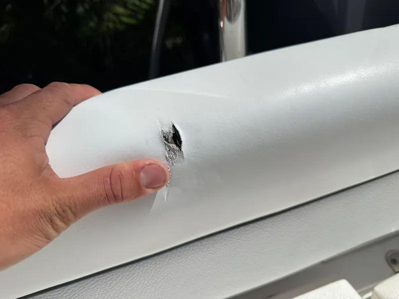 Slide: The Image of Torn upholstery on 2014 Sea Hunt Ultra 211 boat seat. - 15