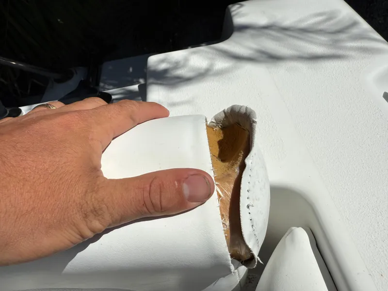 Slide: The Image of Damaged seat cushion on 2014 Sea Hunt Ultra 211 boat. - 16