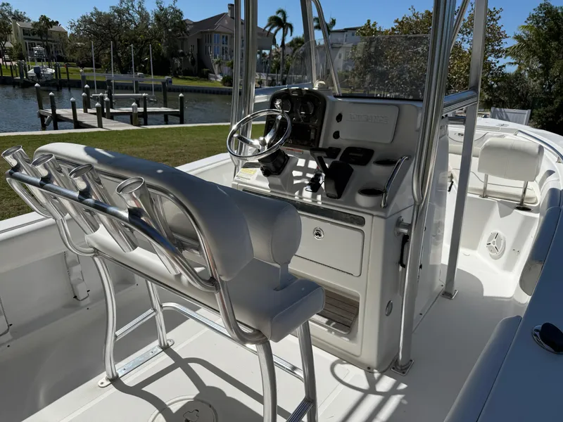 Slide: The Image of 2014 Sea Hunt Ultra 211 boat interior with steering console and seating. - 23