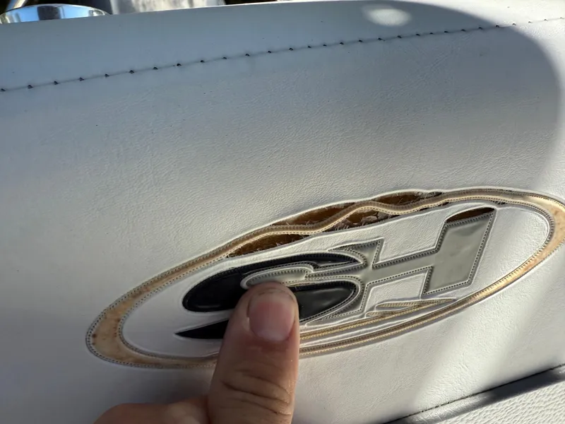 Slide: The Image of Close-up of Sea Hunt Ultra 211 logo on white upholstery, 2014 model. - 26