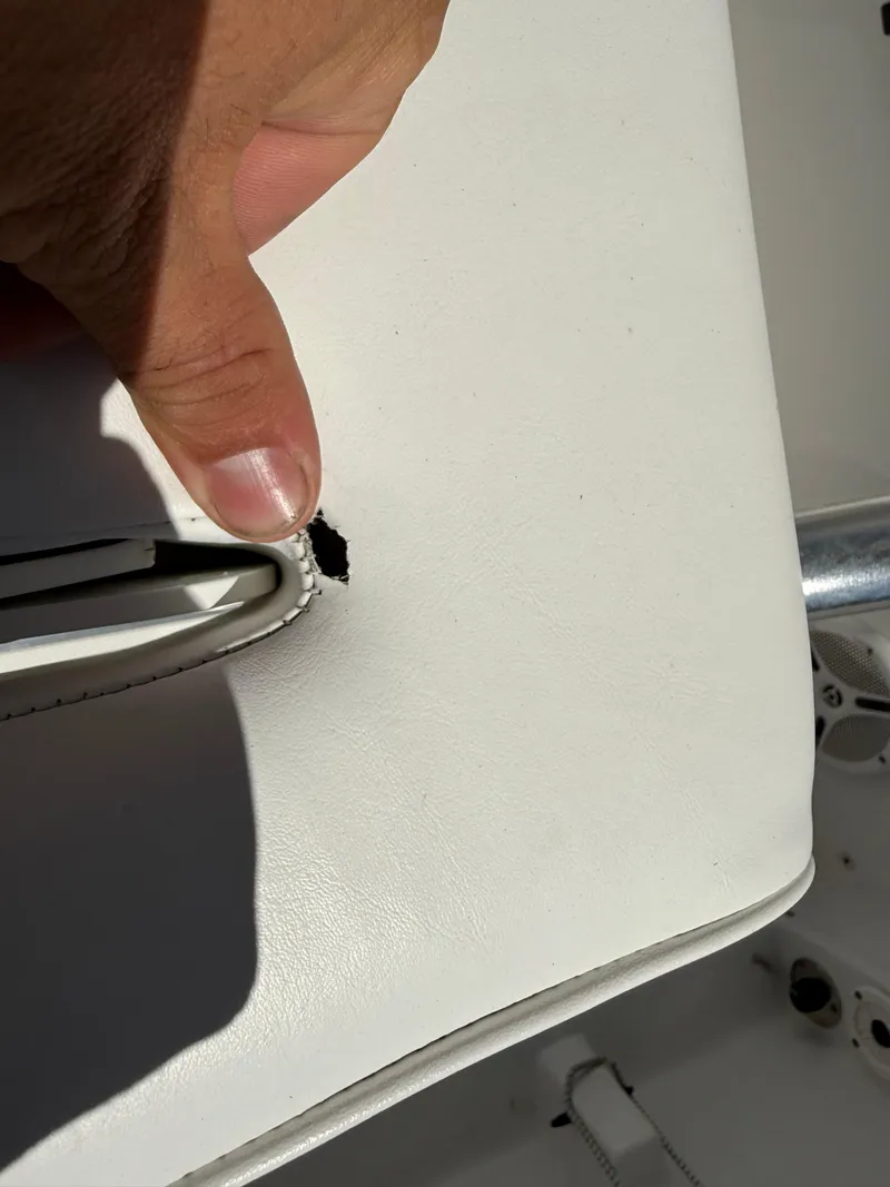 Slide: The Image of Torn upholstery on 2014 Sea Hunt Ultra 211 boat seat. - 28
