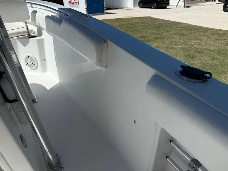 Slide: The Image of 2014 Sea Hunt Ultra 211 boat interior, featuring white seating and sleek design. - 31