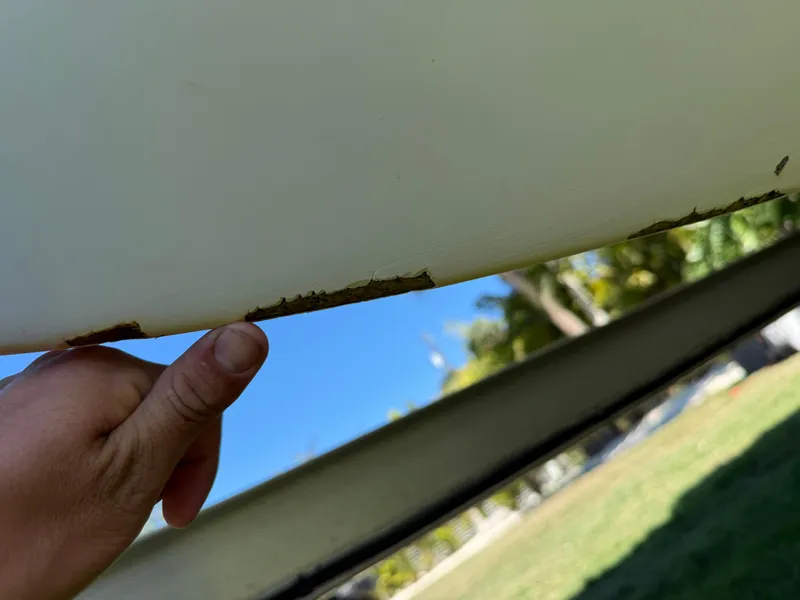 Slide: The Image of Close-up of 2014 Sea Hunt Ultra 211 boat hull with visible damage. - 4