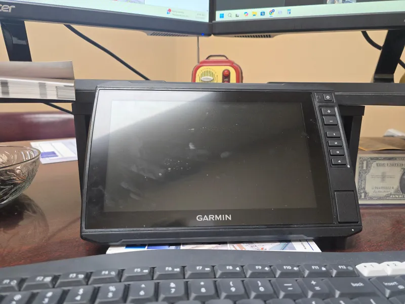 Slide: The Image of Garmin device on desk with keyboard, related to Mako Pro Skiff 17 CC, 2019 model. - 9
