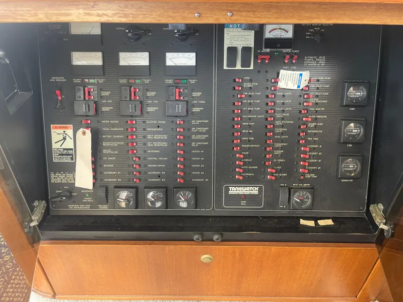 Slide: The Image of Electrical control panel of a 1999 Bayliner 4788 Motoryacht with switches and gauges. - 13