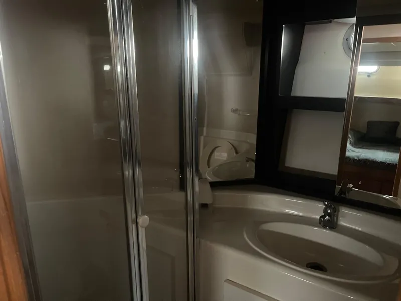 Slide: The Image of Bathroom interior of 1999 Bayliner 4788 Motoryacht with shower and sink. - 21