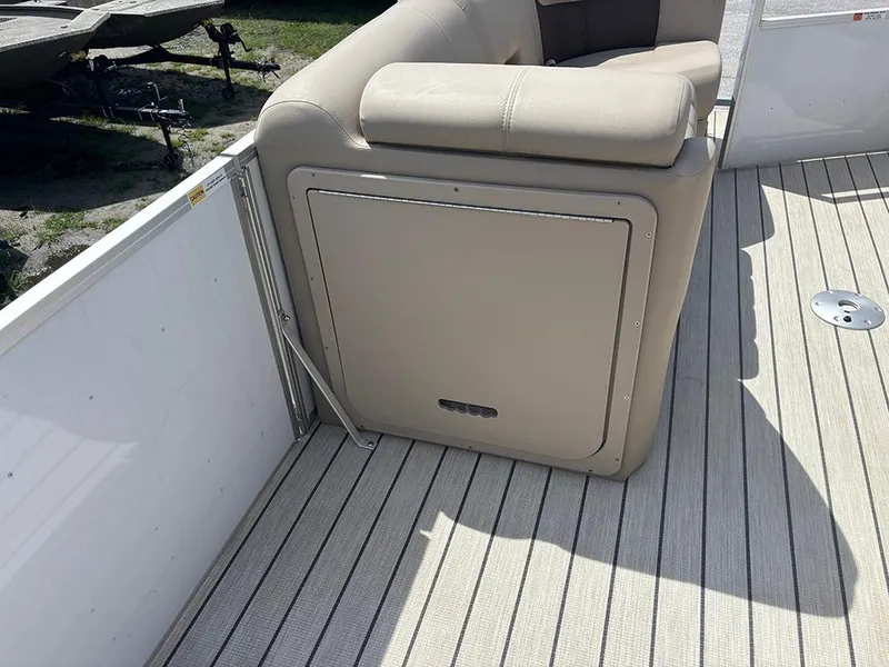Slide: The Image of 2023 SunCatcher Fusion 22RC boat interior with beige seating and deck flooring. - 23