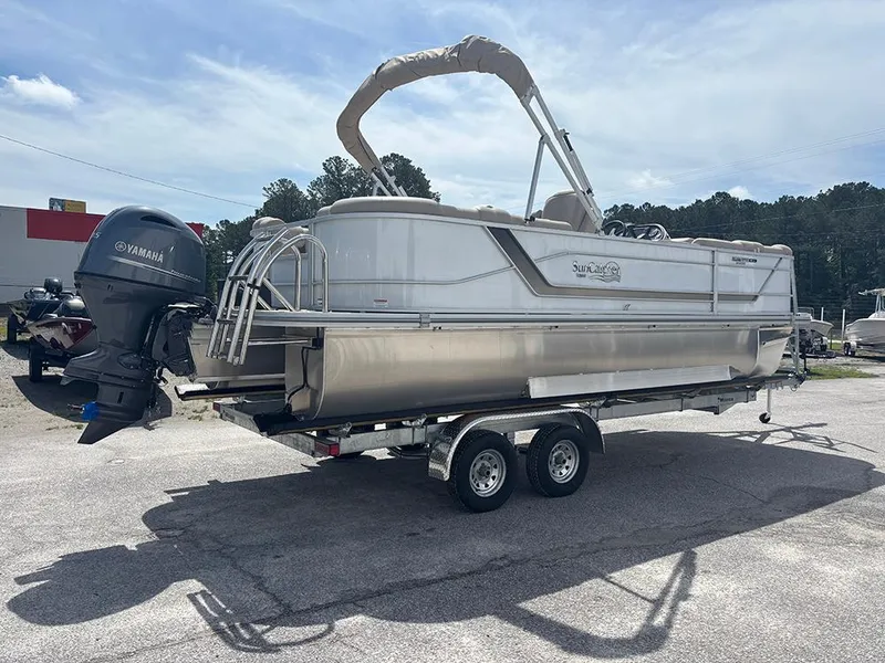 Slide: The Image of 2023 SunCatcher Fusion 22RC pontoon boat on trailer, featuring Yamaha outboard motor. - 5