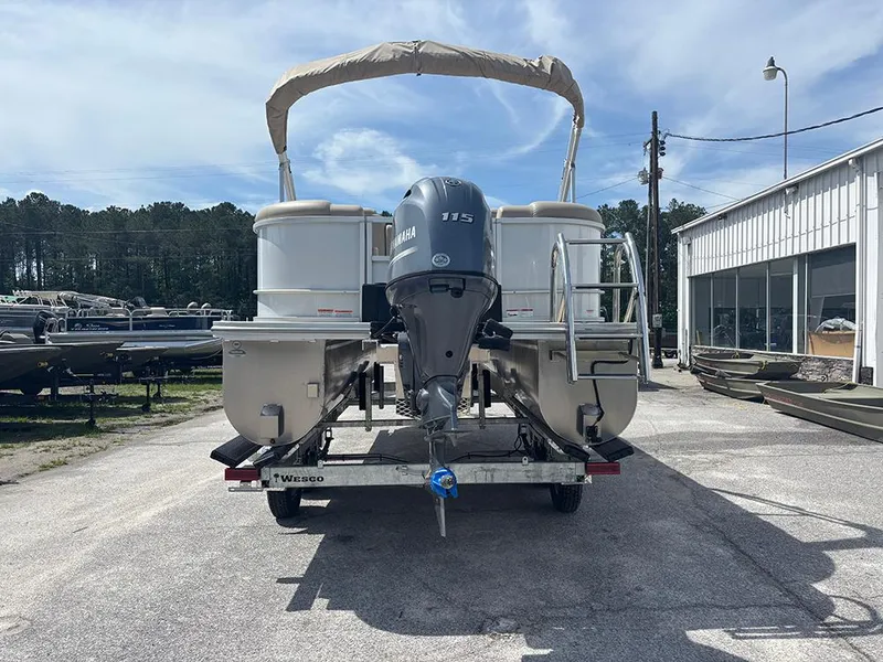 Slide: The Image of 2023 SunCatcher Fusion 22RC pontoon boat on trailer, rear view with Yamaha outboard motor. - 6