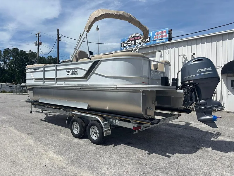 Slide: The Image of 2023 SunCatcher Fusion 22RC pontoon boat on trailer with Yamaha outboard motor. - 7