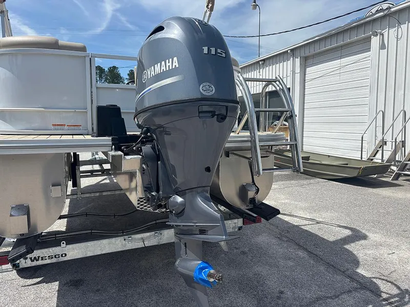 Slide: The Image of 2023 SunCatcher Fusion 22RC with Yamaha 115 outboard motor on trailer. - 8