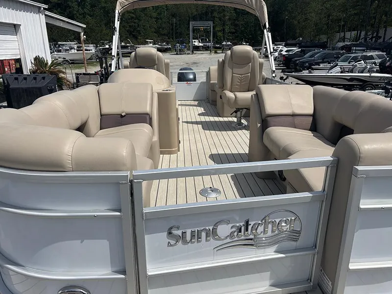 Slide: The Image of 2023 SunCatcher Fusion 22RC pontoon boat with beige seating and spacious deck. - 9