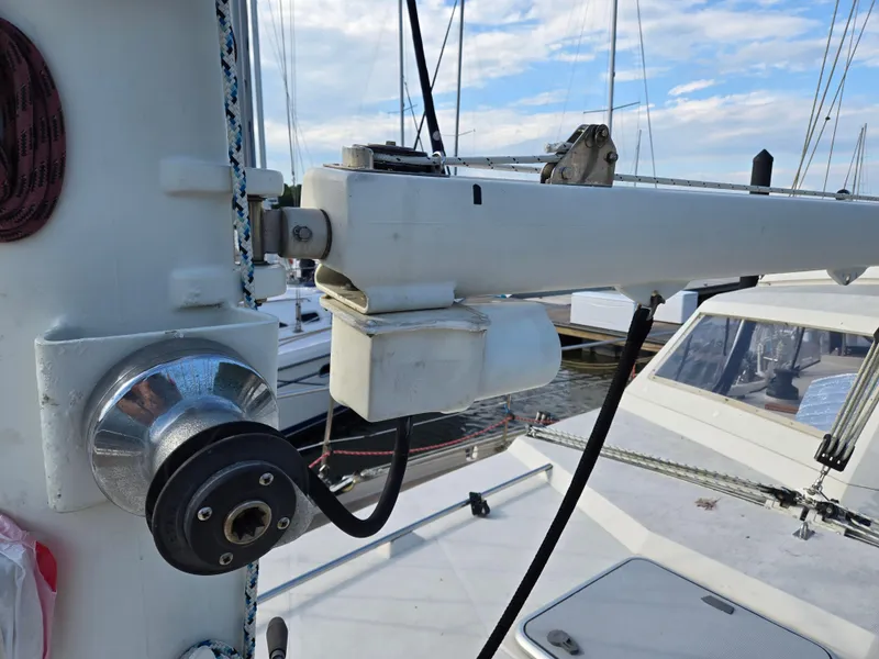 Slide: The Image of Close-up of 1985 Amel Maramu sailboat rigging and winch in a marina. - 11