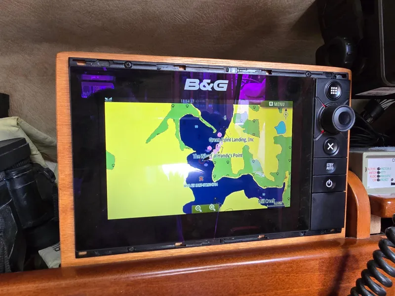 Slide: The Image of B&G marine navigation system on 1985 Amel Maramu sailboat, displaying a colorful nautical chart. - 23