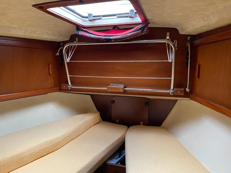 Slide: The Image of 1985 Amel Maramu cabin interior with twin berths and wooden finish. - 35